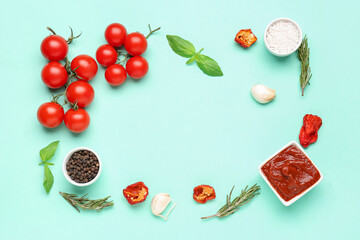 Frame made of delicious tomato sauce and ingredients on turquoise background