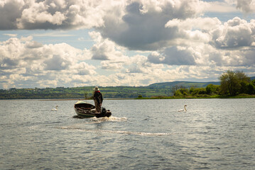 retired man fishing on the lake