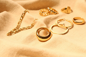 Beautiful jewellery on color fabric background