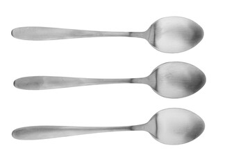 Stainless steel spoons on white background