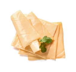 Slices of tasty processed cheese with herbs on white background