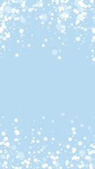 Beautiful snowfall christmas background. Subtle flying snow flakes and stars on light blue winter backdrop. Beautiful snowfall overlay template. Vertical vector illustration.