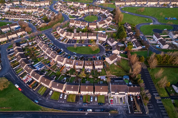 High density residential area in Galway city, Ireland. Sunset sky and warm and cold colors. Aerial...