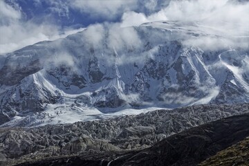 A breathtaking panoramic shot captures the majestic beauty of the Manaslu Glaciers, stretching as far as the eye can see, while the towering presence of Mt. Manaslu.