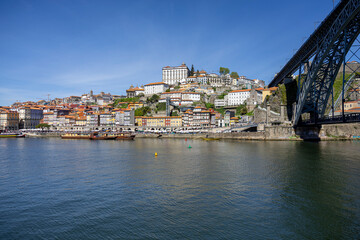 Porto, Portugal. View of the Dom Luis I Bridge over Douro river and the cityscape of Porto in the background.