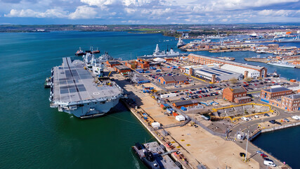 Aerial view of an aircraft carrier of the Royal Navy moored in Portsmouth Harbour on the English...