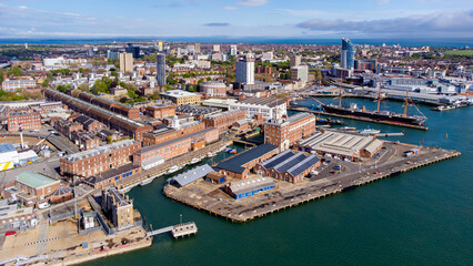 Aerial view of Portsmouth Historic Dockyard and the Royal Navy's ancient HMS Warrior warship on the...