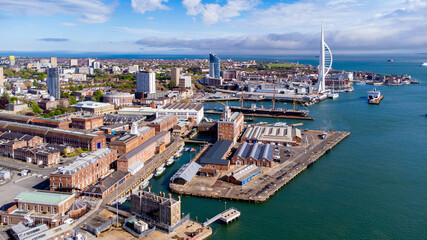 Aerial view of Portsmouth Historic Dockyard and the Royal Navy's ancient HMS Warrior warship as...