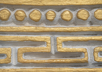 Gold painted concrete architectural abstract design
