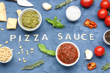 Composition with text PIZZA SAUCE and ingredients on blue table