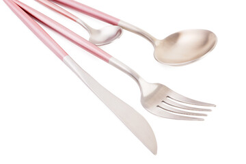 Stainless steel set of cutlery with pink handles on white background