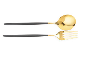 Golden spoon and fork with black handles on white background