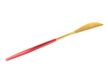 Golden knife with red handle on white background