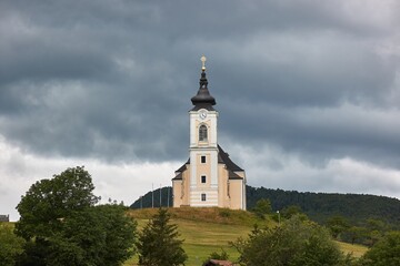 Fototapeta na wymiar Church on a green hill