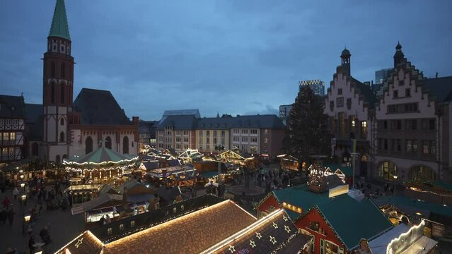 Christmas Market and carousel from elevated position in Romerberg Square at dusk, Frankfurt am Main, Hesse