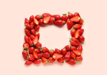 Frame made of fresh strawberries on pink background