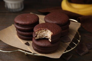Delicious banana choco pies on table, closeup