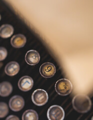 Vintage typewriter with Cyrillic alphabet characters keyboard, writing a text letter on empty page...