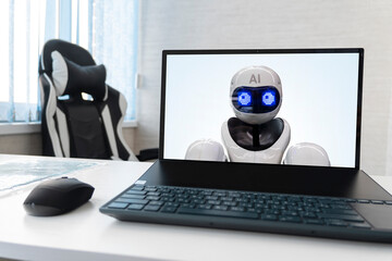 replacing a person with artificial intelligence. laptop with a robot on the screen. dismissal of employees and replacement by robots concept. neural network displaces workers.