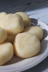 Pile of Indonesian traditional food called entho made of cassava in a plate on the table

