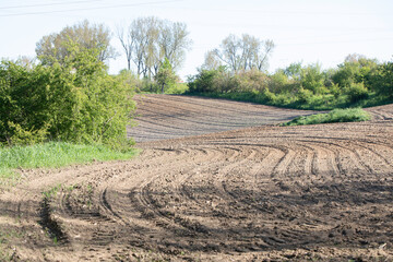 Ploughed field, soil, dirt - furrows of plowed land, autumn in agriculture, Poland