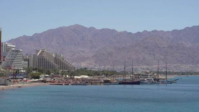 Beach Vacation Destination by the Red Sea with Mountain Background, Eilat, Israel - Wide