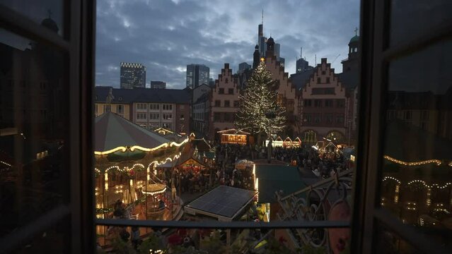Christmas Market and carousel from elevated position in Romerberg Square at dusk, Frankfurt am Main, Hesse