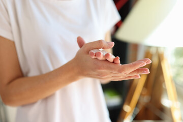 Female cleaning hands using antiseptic, personal hygiene