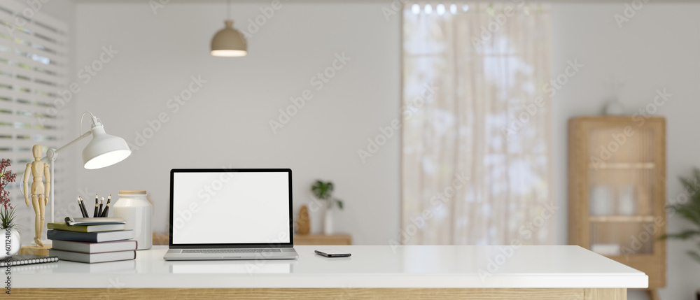 Poster a study table in a minimal scandinavian room with laptop mockup and copy space