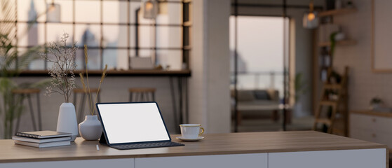 Portable tablet mockup on a table in minimal cozy cafe co-working space.
