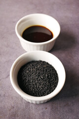 Obraz na płótnie Canvas Black Cumin seed in a container on table 