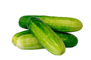 Four cucumbers for fresh vegetables, in a stack composition
