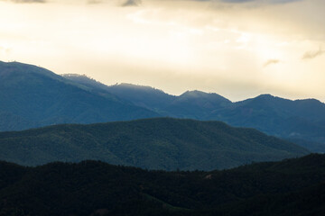 Top view Landscape of Morning Mist with Mountain Layer at north of Thailand. mountain ridge and clouds in rural jungle bush forest