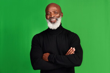 Happy, arms crossed and portrait of black man on green screen for confident, fashion and elegant style. Happiness, smile and senior with male model isolated on studio background for pride and mockup - Powered by Adobe