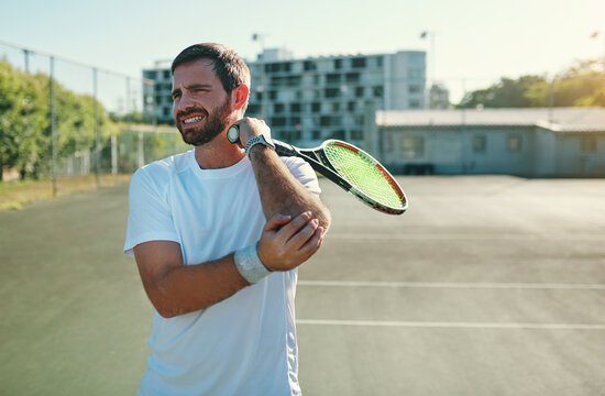Tennis, injury and joint pain by man at court for fitness, training or workout with problem. Sports, accident and male player with arthritis and injured arm, osteoporosis and muscle or fibromyalgia