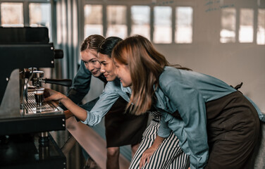 Young adult coffee makers work with skilled baristas to create menus. Using a coffee machine to make hot and cold coffee. Experiment with grinding and blending, including adding milk foam on top.