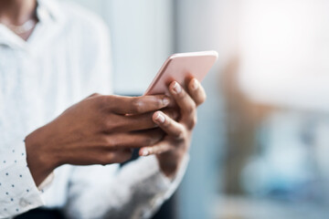 Businesswoman, typing and closeup of hands with a phone on social media, mobile app or internet. Technology, communication and cellphone for browsing or networking on online website or text message.