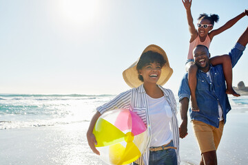 Black family, beach ball and summer at the beach while happy and walking together holding hands....