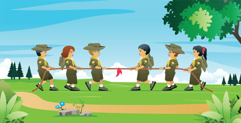 Students in scout uniforms are tug of war in a nature park.