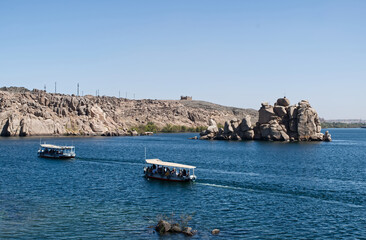 Boats approaching the temple of Philae, complex dedicated to the goddess Isis. Egypt