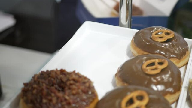 View To Showcase Of Homemade Donut Doughnut Pastry In Window Display Shop For Tasty Desert Snack, Fastfood Unhealthy Sweet Snack