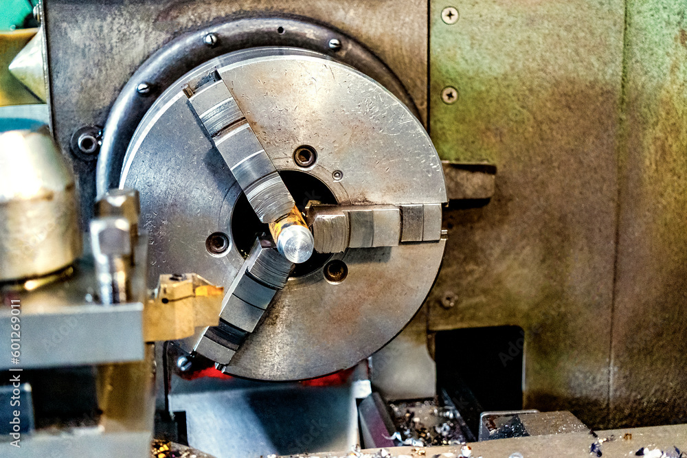 Poster an element of a lathe for fixing a metal part for processing. industrial processing of metal product
