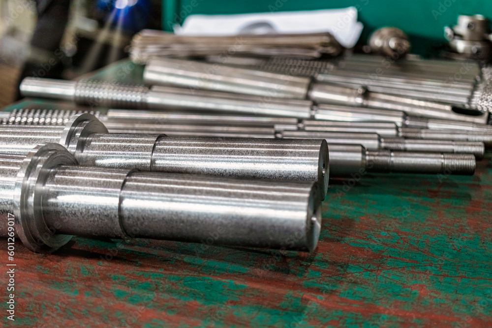 Poster a set of milling cutters on a rack near a lathe. metalworking cutting mills for cnc machines. indust