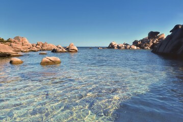  clear sea blue turquoise and rock in Corsica island at palombaggia beach
