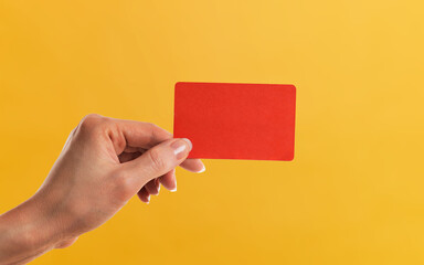 hand holding a blank card