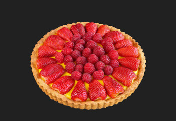 fruits cake decorated with berries isolated on dark background