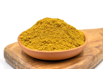 Cumin powder isolated on white background. Cumin powder on wood flipchart. Spice concept