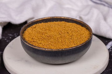 Cumin powder on dark background. spice or seasoning concept. Ground or sifted garam masala. indian spice. Close up