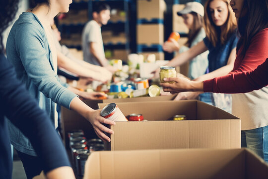 A group of unrecognizable people volunteering at a local food bank showcasing compassion generosity and community service,