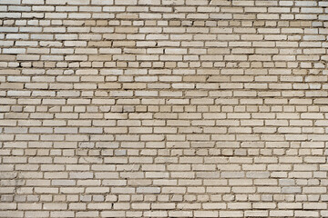 Fototapeta premium Brick white wall background. White stone brickwork.